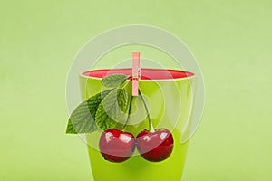 Cherries on green background