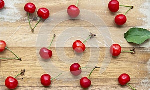 Cherries on a neutral wood background