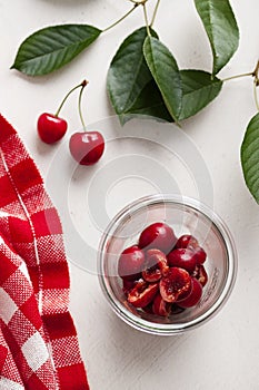 Cherries ready for jam in a jar