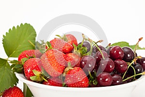Cherries and strawberries in a bowl