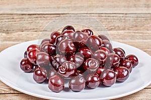 Cherries on white plate