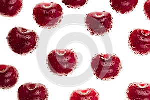 Cherry background. Ripe fresh glossy rich cherries on white background. Isolated. Macro. Texture. Pattern. Fruit background.