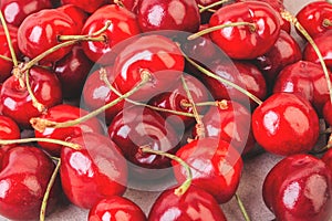 Cherry on a beige background. Macro