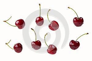 Cherry berries isolated on a white  in a chaotic manner
