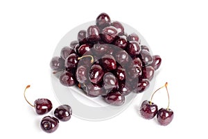 Cherry berries in water drops on white plate white background isolated close up macro