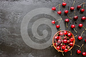 Cherry on a black background with space for text