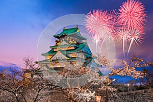 Cherry blossom with fireworks at Osaka castle ,Japan