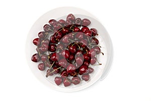Cherry in ceramic bowl isolated on white
