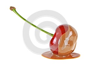 Cherry in chocolate on white background