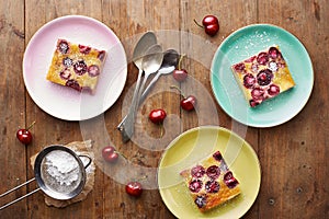 Cherry clafoutis pie on wooden table