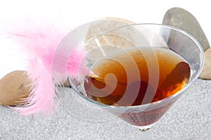 Cherry cocktail in a environment of sand and pebble stones