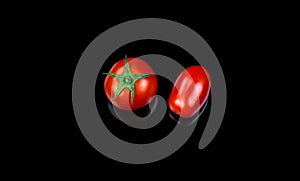 Cherry and datterino tomato on black background fresh biological