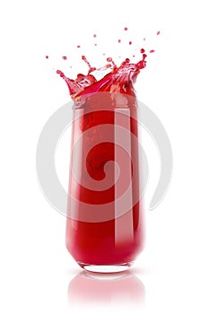 Cherry fresh red juice in glass with reflection, drops and splashind isolated on white background. Vitamin organic summer drink