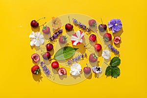 Cherry fruits pattern in a vibrant summer mood on bright yellow