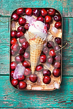 Cherry ice cream in a waffle cone