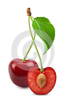 Cherry isolated. Sweet cherry and half cherry with green leaves on a white background.