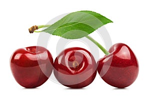Cherry isolated. Three sweet cherries with a leaf on a white background. Fresh fruit berries.