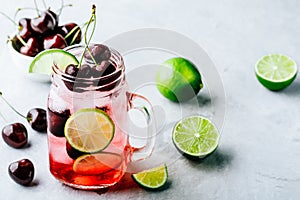 Cherry Limeade or Lemonade in glass mason jar. Ice cold summer drink.