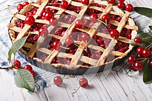 Cherry pie and ripe berries on the table. Horizontal