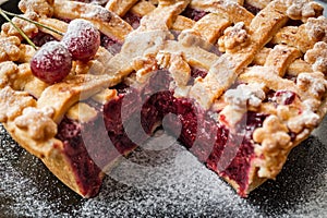 Cherry pie with slice removed photo