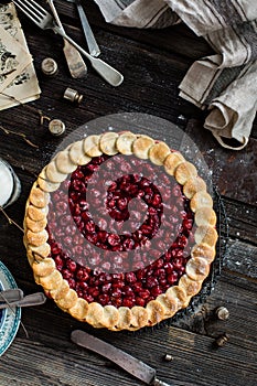 Cherry pie on wooden rustic table