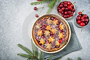 Cherry piecake with fresh cherry. Christmas decotation