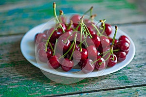 Cherry on a plate on table