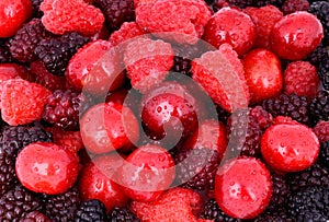 Cherry, raspberry, blackberry on full background