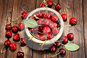 Cherry. Red fresh Cherries in bowl and a bunch of cherries on th