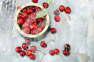 Cherry. Red fresh Cherries in bowl and a bunch of cherries on th