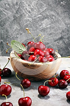 Cherry. Red fresh Cherries in bowl and a bunch of cherries on th