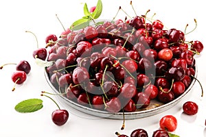 Cherry. Red fresh Cherries in bowl and a bunch of cherries on th