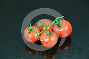 Cherry Tomato on Dark Glass