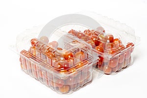 Cherry tomato in plastic container package, studio shoot on whit
