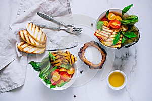 Cherry tomato salad with grilled haloumi cheese, with chard and