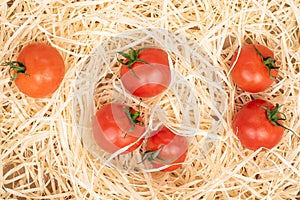 Cherry tomato on straw mat