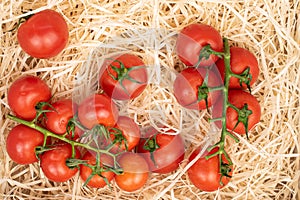 Cherry tomato on straw mat
