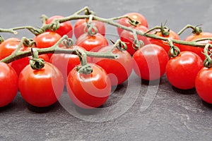 Cherry tomatoes on a black background