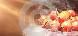 Cherry tomatoes on a black background in the spray