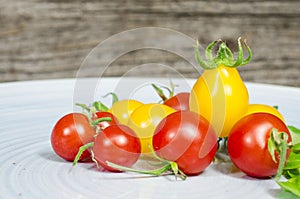 Cherry tomatoes on blue plate
