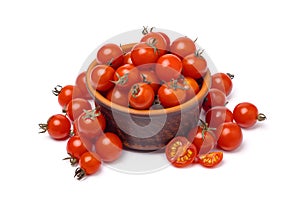 Cherry tomatoes in bowl on white background close up