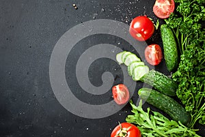 Cherry tomatoes on a branch, cucumber, parsley