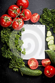 Cherry tomatoes on a branch, cucumber, parsley