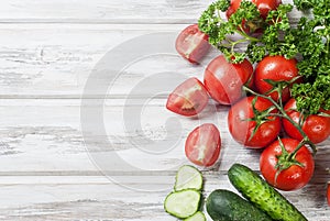 Cherry tomatoes on a branch, cucumber, parsley