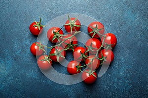 Cherry tomatoes on branches with copy space, top view
