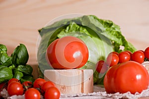 Cherry tomatoes, cabbage on a deervian background. preparation of salad. Summer concept of proper healthy eating.