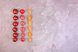 Cherry tomatoes on gray marble background. Copyspace