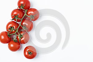 Cherry tomatoes isolated on white background. Branch of fresh tomatoes. Top View. Copy space