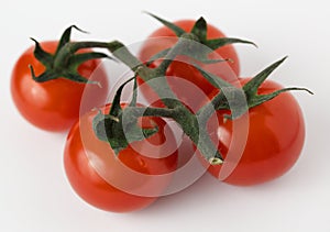 Cherry tomatoes on a light background close-up
