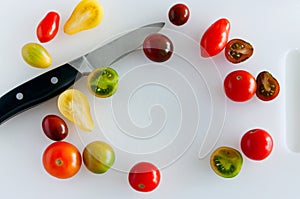 Cherry tomatoes and paring knife